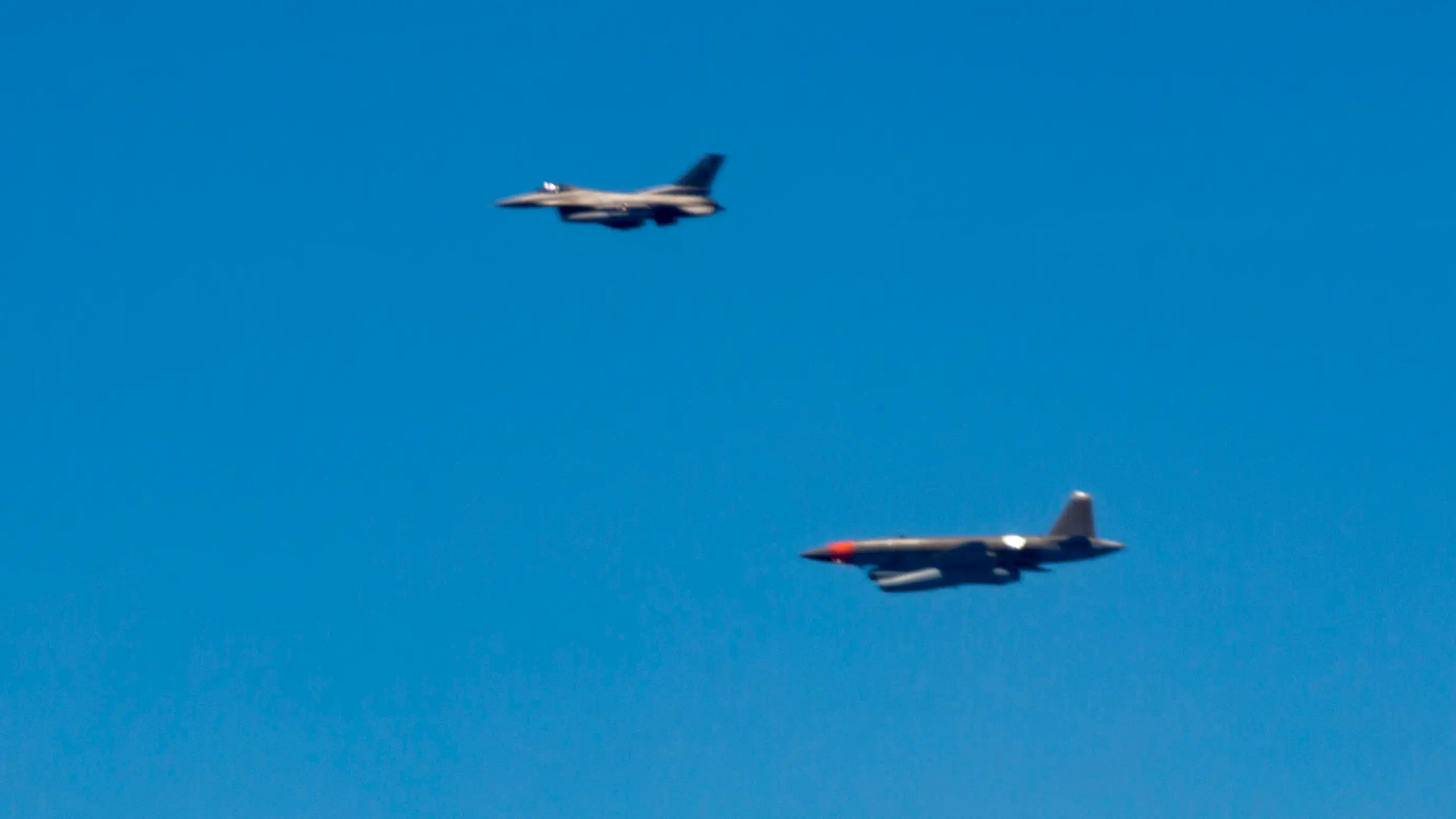 Maj. Nathan McCaskey, an F-16 Test Pilot with the 96th Test Wing, observes an autonomous UTAP-22 aircraft over the Gulf of Mexico, May 5, 2021